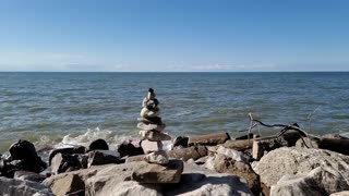 Watch Waves in Slow Motion Behind a Rock Tower