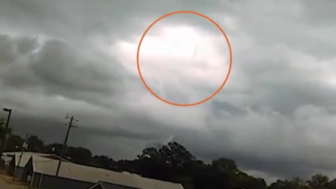 Onlookers Witness Figure Walking In The Clouds