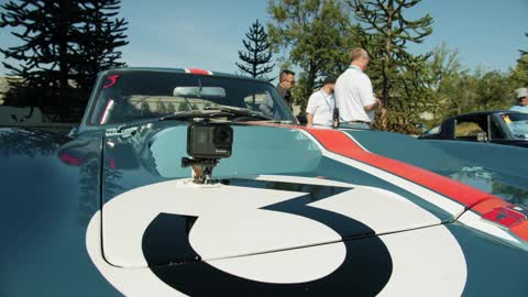 A Racing Car On Display Outdoors In A Car Show