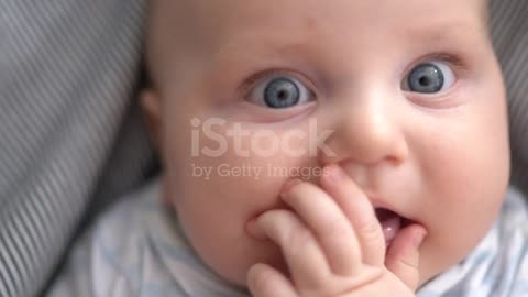 Little baby boy, relaxing in bed after bath, smiling happy, day