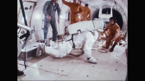 Astronauts Neil Armstrong And Buzz Aldrin Practice Getting Up After Falling In their Space Suits 196