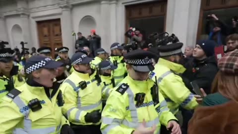 Police arrest Tommy Robinson in London.