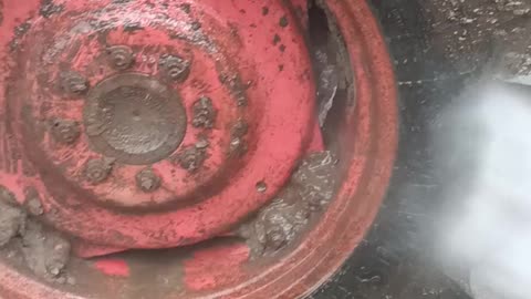 Washing tractor at my Garage