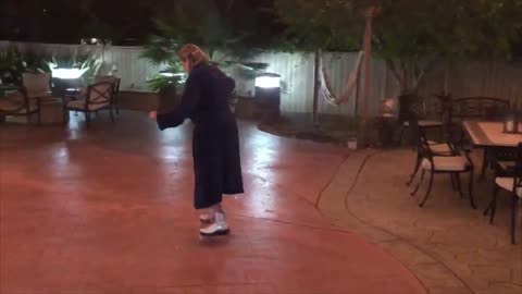 Woman Wearing a Robe Falls While Roller Skating