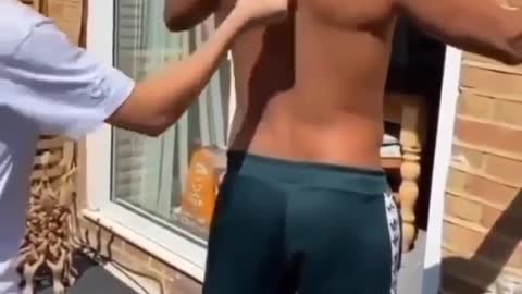 Guy Breaks Oranges With his Bare Back