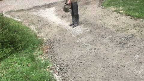 brushing CHEAP concrete onto a gravel driveway (adding strength and resilience)