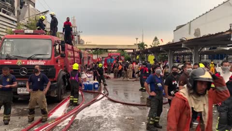 Firefighters douse flames after explosion at plastics factory near Bangkok