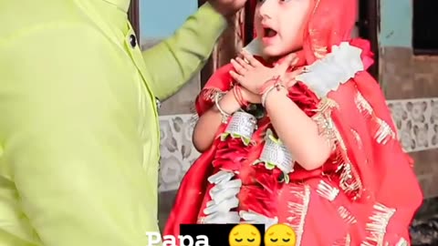 A small daughter sing with their father bidayee song