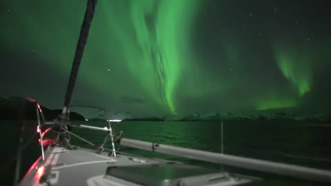 Aurora Borealis in Tromsø, Norway. Sailing under the Northern Lights.