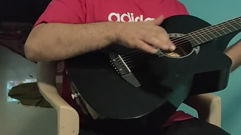 Afgani playing guitar