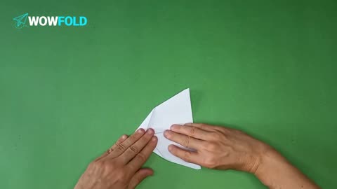 White Feather - folding a paper airplane