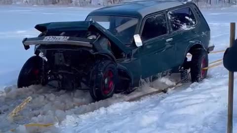 Car Collapses During Frozen Lake Recovery