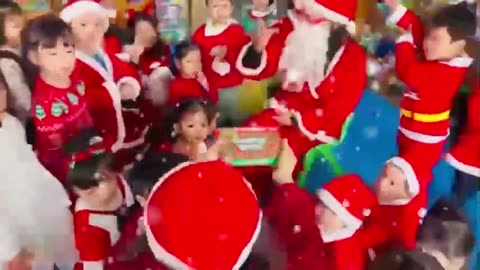 Children receive gifts from Santa Claus :Merry Christmas