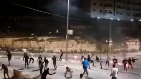 Molotov cocktails are thrown at an Israeli convoy entering the Palestinian city of Ramallah.