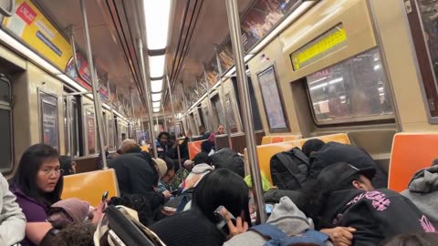 People take cover on the New York City subway after man is shot in the head, suspect in custody