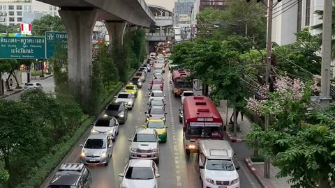 stock footage traffic road in middle of the city with high rise buildings under the bridge