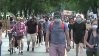 Protesters march down the National Mall in Washington, D.C.