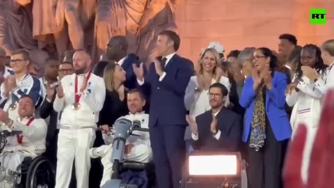 Macron jumps strangely in front of disabled Paralympic athletes