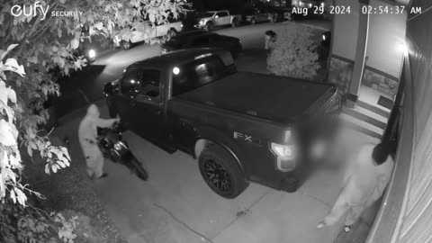 BREAKING: Masked gang waving AR-style rifle attacks a home in a Denver suburb.