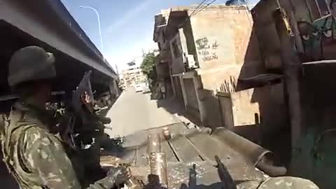 MOMENT THAT ARMY SOLDIER IS SHOT INTO HELMET BRAZIL