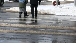 Security Guard Kindly Escorts Blind Man Across Street