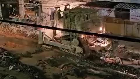 The IDF Israel forces armored bulldozer on the streets of Jenin, West Bank