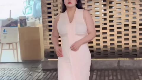 Arab beauty exposed on white colored tight outfit