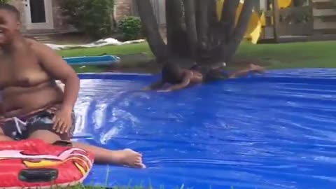 Collab copyright protection - little boy slips on slip n slide