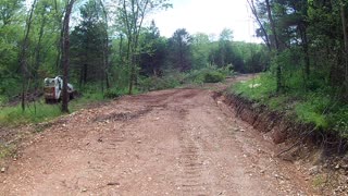 Pushing some trees over using my Bobcat S250 skid steer