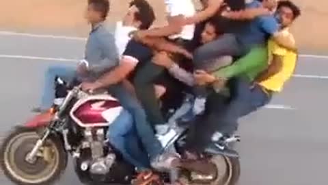 Amazing bike riding or stunt with loaded riders.