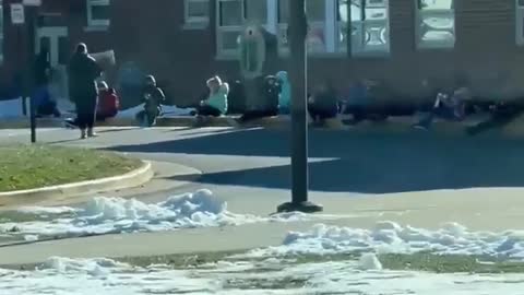 Shocking video shows elementary school kids sitting outside in freezing cold weather