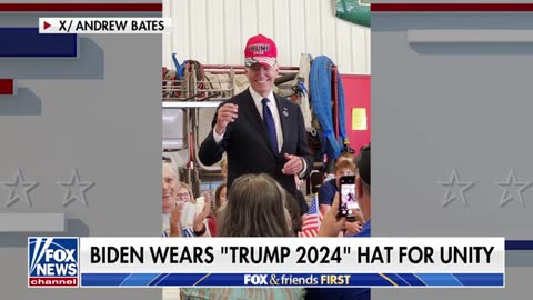 Biden sports 'Trump 2024' hat in spirit of unity