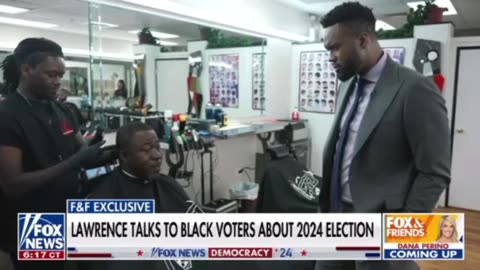 Lawrence talks to voters at the barbershop in Chicago