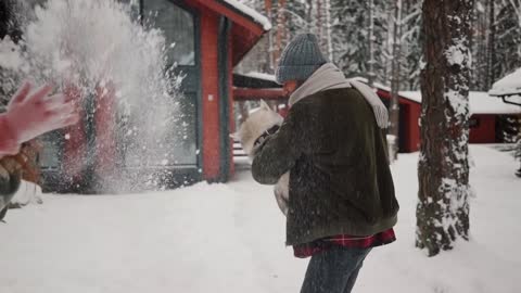 Husky enjoying snow with family