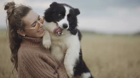 Dog lover stylish girl wearing sunglasses hugging her doggy during they walk