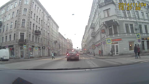 Van flips over and nearly takes over 2 pedestrians