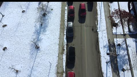 Drone flying over lake and surrounding area