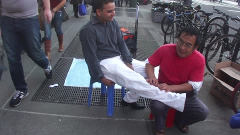 Luodong Massages Man In White Pants On Sidewalk