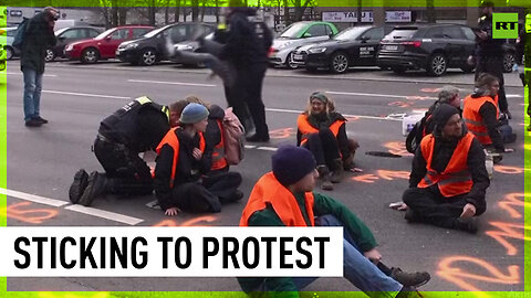 Climate protesters glue themselves to Berlin road