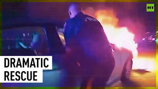 New Jersey police rescue man trapped in burning car