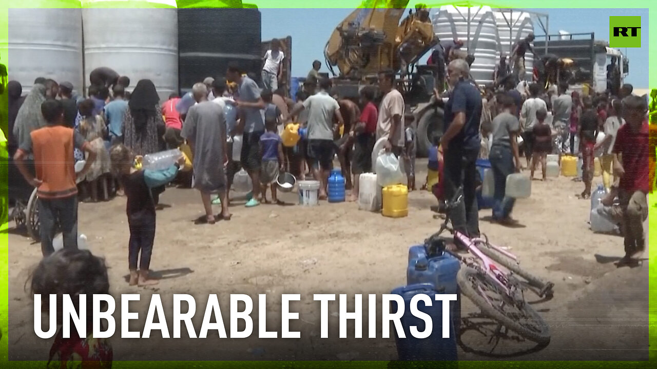 Palestinians gather around water tanks to collect drinking water amid shortages