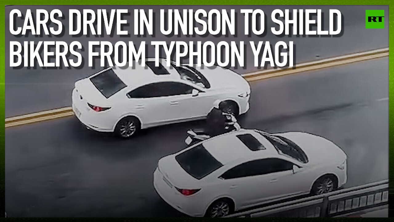 Cars drive in unison to shield bikers from Typhoon Yagi