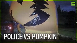 Police officer battles runaway giant inflatable PUMPKIN