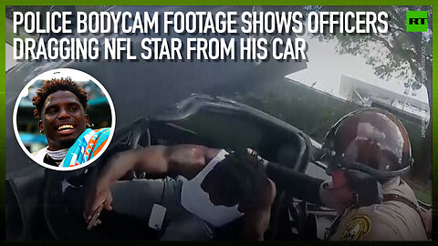 Police bodycam footage shows officers dragging NFL star from his car