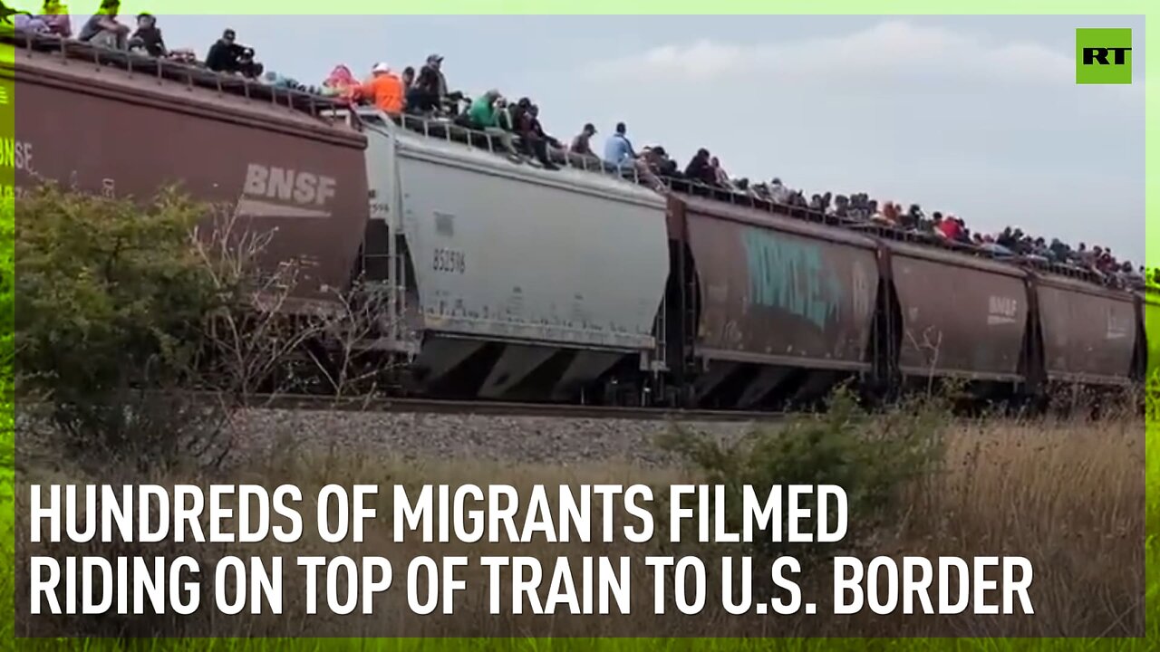 Hundreds of migrants filmed riding on top of train to US border