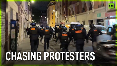 Police chase protesters after rally against right-wing political forces in Paris