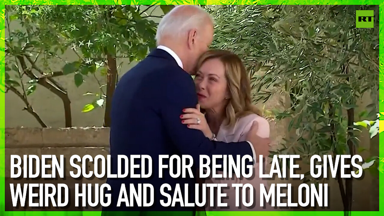 Biden scolded for being late, gives weird hug and salute to Meloni