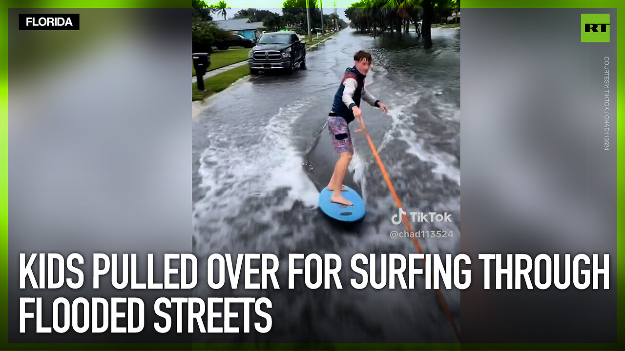 Kids pulled over for surfing through flooded streets