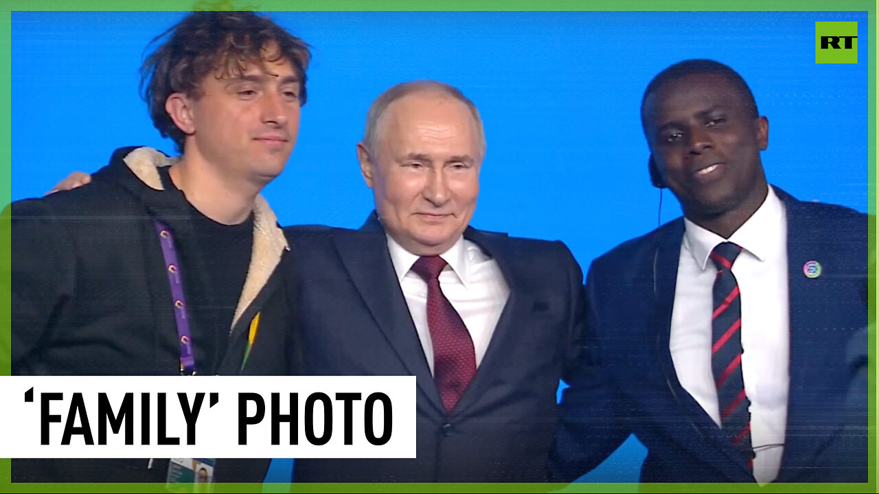 Putin takes photos with Jorit and his Ugandan 'son'