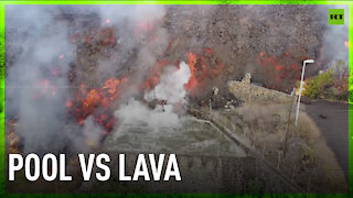 Lava pours into swimming pool as eruption reaches La Palma residential area